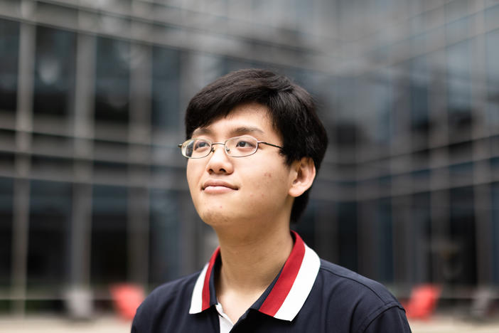 An Nguyen sits for a portrait at George Mason University in Fairfax, Va. Nguyen had just turned four when his father died in the 9/11 attack on the Pentagon.