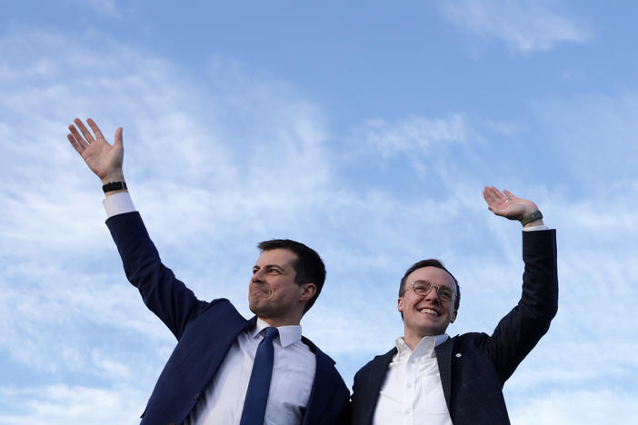 Pete Buttigieg (left), now the secretary of transportation, appears alongside his husband, Chasten, in February 2020. The couple are now the parents of two children.