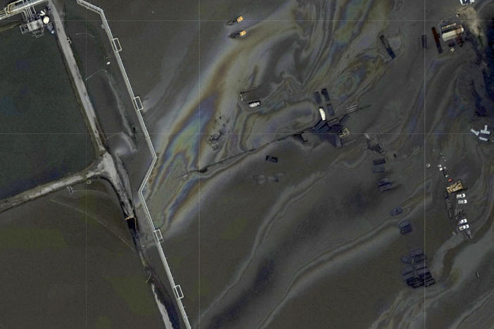 This image provided by NOAA taken Tuesday, Aug. 31, 2021 and reviewed by The Associated Press shows oil slicks at the flooded Phillips 66 Alliance Refinery in Belle Chasse, La. It's just one of the oil spills being looked into in the Gulf region in the aftermath of Hurricane Ida.