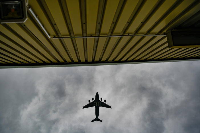 A plane flies over temporary camp for refugees from Afghanistan at the U.S. Army's Rhine Ordnance Barracks (ROB), where they are being temporarily housed, on August 30, 2021 in Kaiserslautern, Germany.