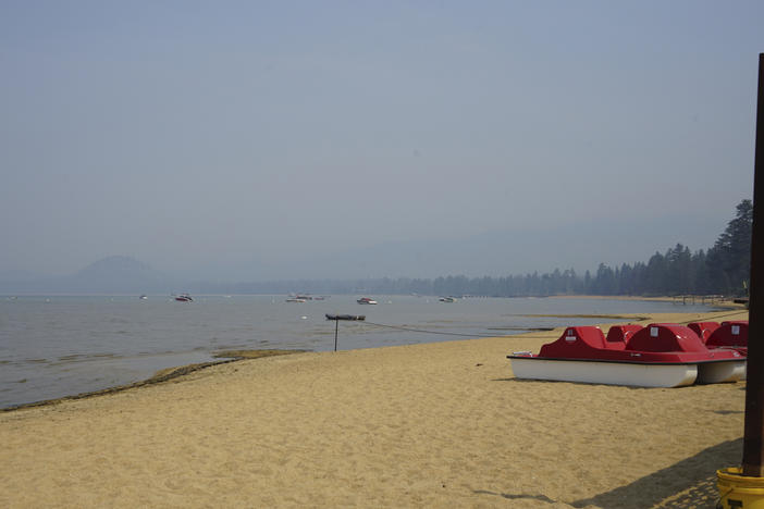 Smoke shrouds parts of Lake Tahoe visible from the Ski Run Marina in downtown South Lake Tahoe on Monday.