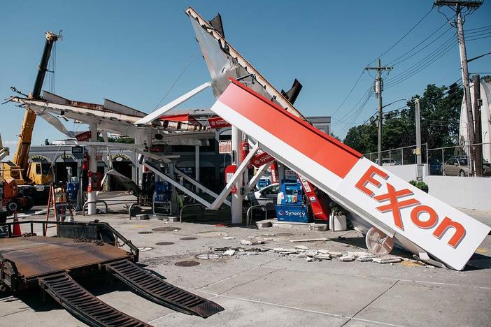 Workers clean a gas station damaged by the remnants of Hurricane Ida in New York City. Scientists warn that 60% of world oil reserves need to stay underground to avoid the worst impacts of climate change.