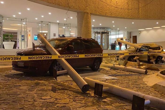 Damaged cars are seen outside a hotel after a quake in Acapulco, Guerrero state, Mexico, on Wednesday.