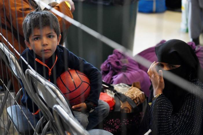 Afghan refugees wait to be processed Sept. 8 inside Hangar 5 at Ramstein Air Base in Germany.