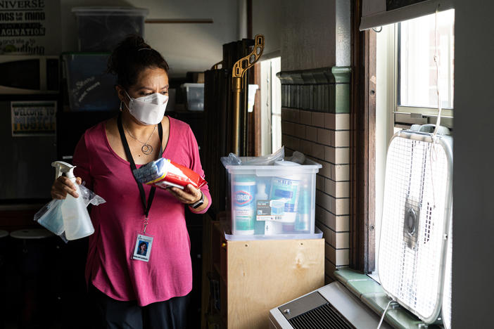 Before classes begin for the day, elementary music teacher Penelope Quesada gathers her most commonly used cleaning supplies and places them around the classroom in places of convenience.