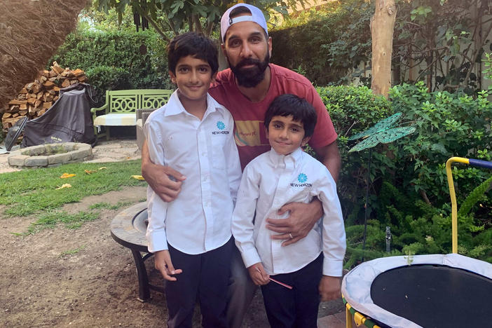 Ali Malik, 37, with his sons Muhammad Binyamin, 9, and Layth Noah, 5. Malik is part of a class action lawsuit against the FBI alleging religious discrimination and violations of surveillance laws.