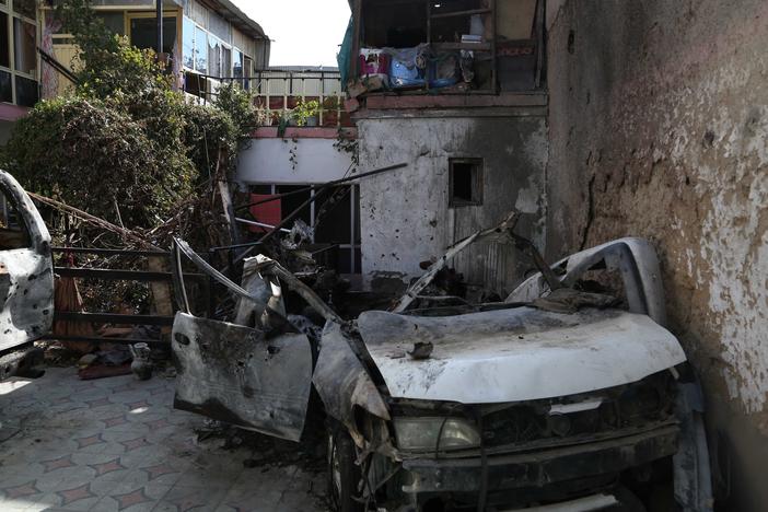 The aftermath of a U.S. drone strike on a car allegedly driven by Zemari Ahmadi.