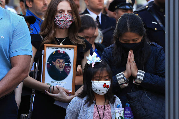 Family members and loved ones of victims of those who died on 9/11 attend the 20th anniversary commemoration ceremony on Saturday at the National September 11 Memorial & Museum in New York City.