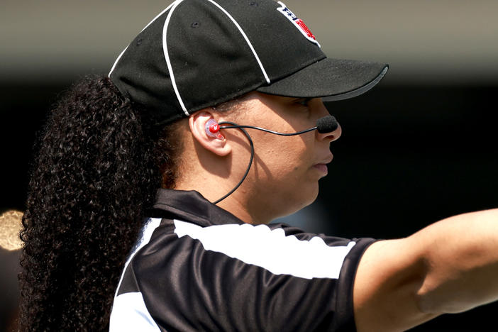 Line judge Maia Chaka signals during the game between the Carolina Panthers and the New York Jets at Bank of America Stadium on Sept. 12 in Charlotte, N.C. Chaka made history as the first Black woman to officiate an NFL game.