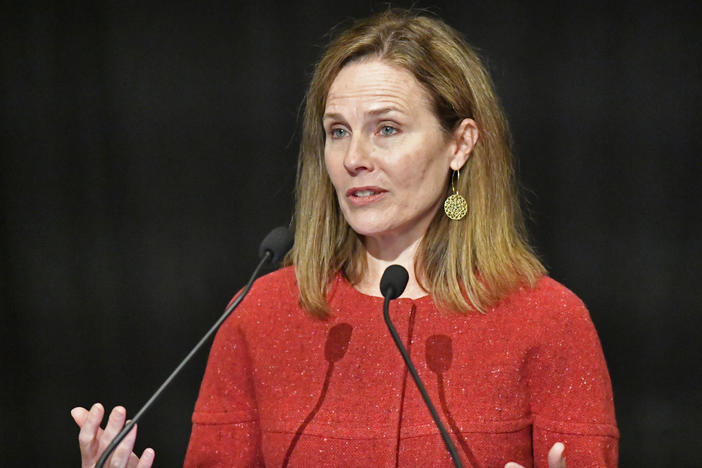 Supreme Court Justice Amy Coney Barrett speaks Sunday at the University of Louisville's McConnell Center in Kentucky. She told an audience that "judicial philosophies are not the same as political parties."