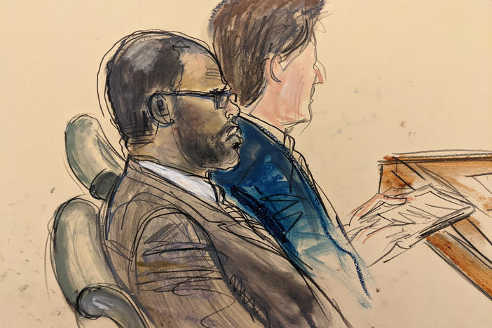 In this courtroom artist's sketch made from a video screen monitor, R. Kelly (left) and lawyer Thomas Farinella listen during the opening day of his trial on Aug. 18, 2021 in Brooklyn, New York.