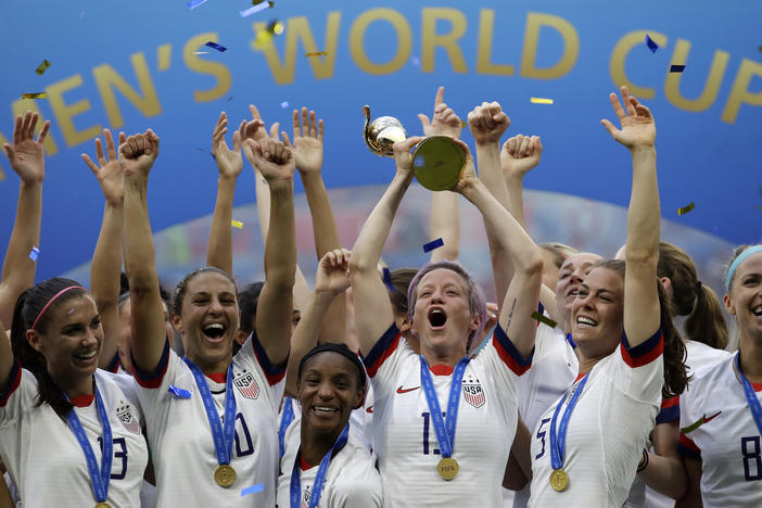 U.S. soccer player Megan Rapinoe raises the trophy in 2019 after winning the Women's World Cup final between the U.S. and The Netherlands in Decines, outside Lyon, France.