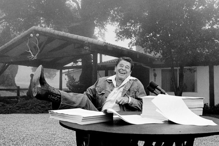President Ronald Reagan shows his boot following the signing of his tax bill in August 1981 at his vacation home near Santa Barbara, Calif.