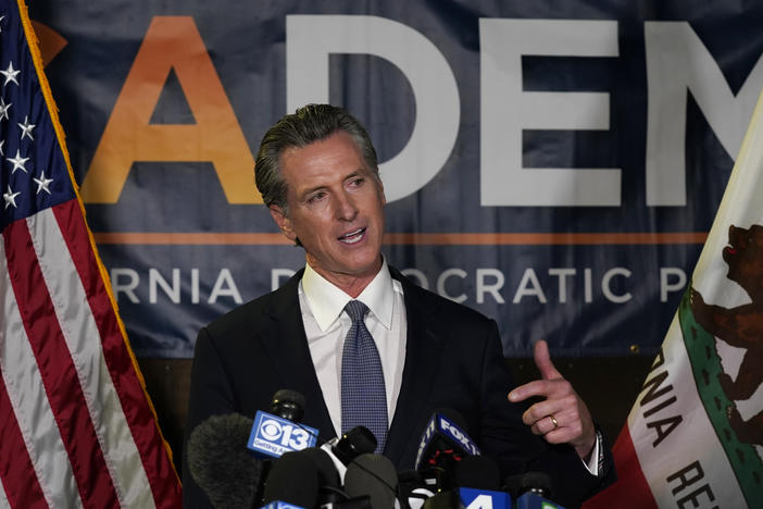 California Gov. Gavin Newsom addresses reporters Tuesday in Sacramento after beating back the recall effort that aimed to remove him from office.