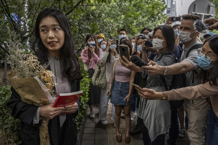 Zhou Xiaoxuan speaks to journalists and supporters on Sept. 14 outside the Haidian District People's Court in Beijing before a hearing in her case. She alleged that she was groped and forcibly kissed by prominent TV anchor Zhu Jun, who denies the allegations and has countersued for defamation. The court ruled there was not sufficient evidence of sexual harassment.