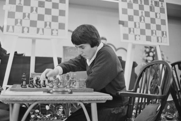 Georgian chess champion Nona Gaprindashvili plays at the International Chess Congress in London on Dec. 30, 1964. She is suing Netflix for defamation and invasion of privacy over its series <em>The Queen's Gambit.</em>