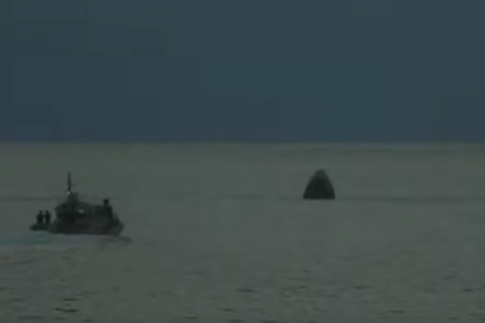 A screen capture of SpaceX's video tracking the reentry of Inspiration4 shows the Dragon spacecraft floating in the Atlantic Ocean off the coast of Florida.