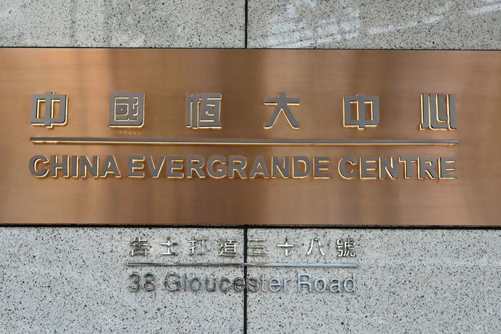 A sign for the China Evergrande Centre, the Hong Kong home for China Evergrande Group, is shown last week. Fears of a debt default at the property developer sparked a global stock market sell-off on Monday.
