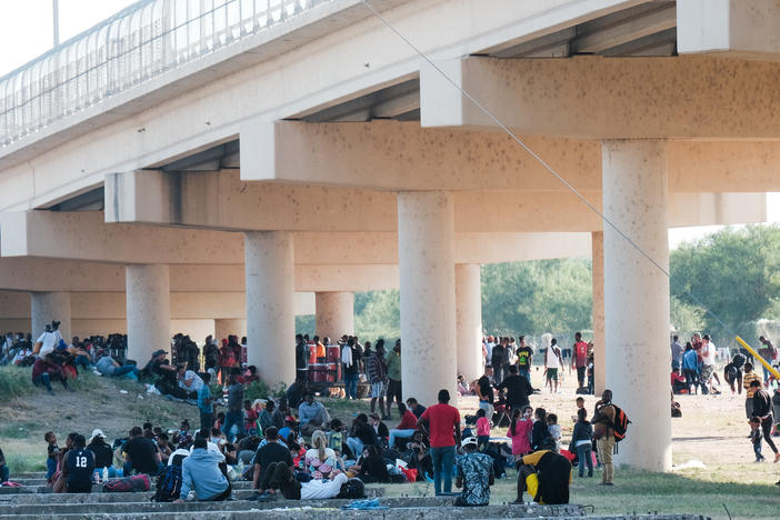 Migrants at the Rio Grande near the port of entry in Del Rio, Texas, on Saturday.