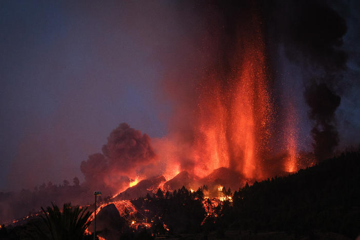 Cumbre Vieja erupts, spewing out columns of smoke, ash and lava, as seen from Los Llanos de Aridane municipality on the Canary island of La Palma on Sunday.