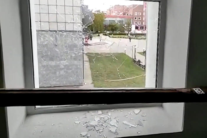A broken window is pictured at the Perm State University where an unidentified man opened fire, killing at least eight people and injuring 24 others.