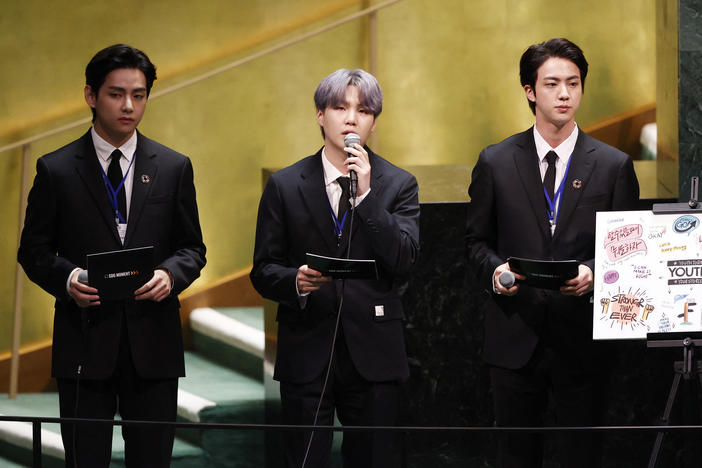 V (from left), Suga and Jin of BTS at the launch of the U.N. General Assembly's 76th session on Monday. The popular boy band from South Korea sang (in a video performance viewed online by more than 1 million) and spoke.