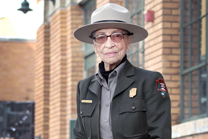 Soskin sits in front of the Rosie the Riveter/WWII Home Front National Historical Park Visitor Education Center.