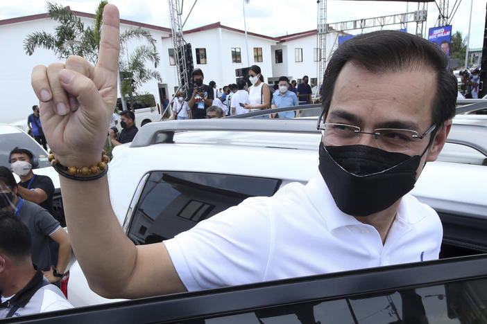 Manila City Mayor Isko Moreno gestures after declaring his bid to run for president in a speech at a public school in the slum area near the place where he grew up in Manila, Philippines on Wednesday Sept. 22, 2021.