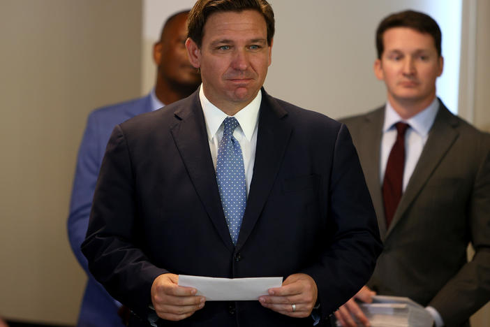 Florida Gov. Ron DeSantis, shown here in August, has appointed Dr. Joseph Ladapo as the state's new surgeon general. Ladapo says vaccines are not the only way to promote "good health."