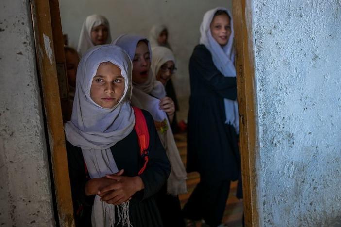 Girls gather at a gender-segregated school in Kabul on Sept. 15. When older secondary students returned to classes, female students were told to wait.