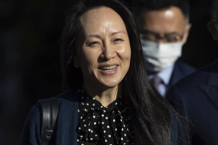 Meng Wanzhou, chief financial officer of Huawei, smiles as she leaves her home in Vancouver on Friday.