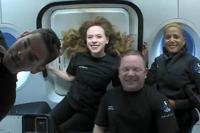 The passengers of Inspiration4 in the Dragon capsule on their first day in space. They are Jared Isaacman (from left), Hayley Arceneaux, Chris Sembroski and Sian Proctor.