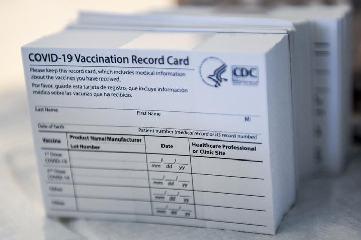 A stack of COVID-19 vaccination record cards from the Centers for Disease Control and Prevention. They provide proof that you've had your shot — but aren't exactly wallet size at 4 by 3 inches.