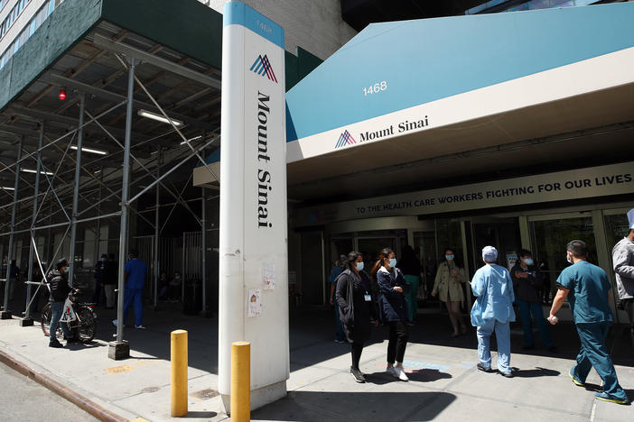 A view of the entrance to Mount Sinai Hospital in New York City on May 14, 2020. Hospital and nursing home workers across New York are required to have at least one dose of a COVID-19 vaccine by Monday, prompting concerns over noncompliance and potential staffing shortages.