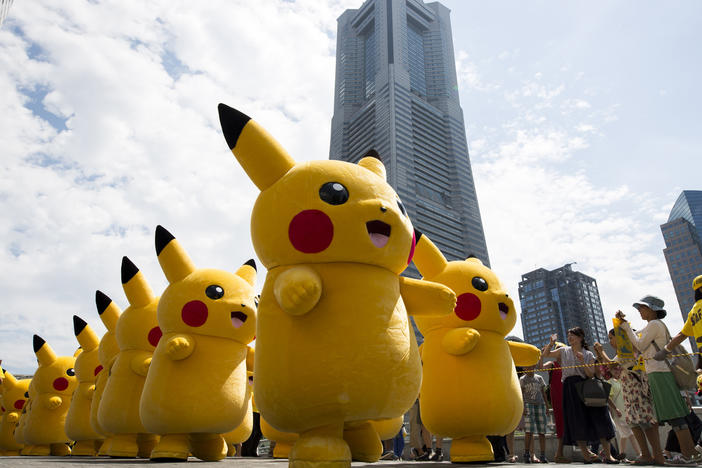 Performers dressed as Pikachu, a character from Pokemon series, march during the Pikachu Outbreak event hosted by The Pokemon Co. on August 9, 2017 in Yokohama, Kanagawa, Japan.