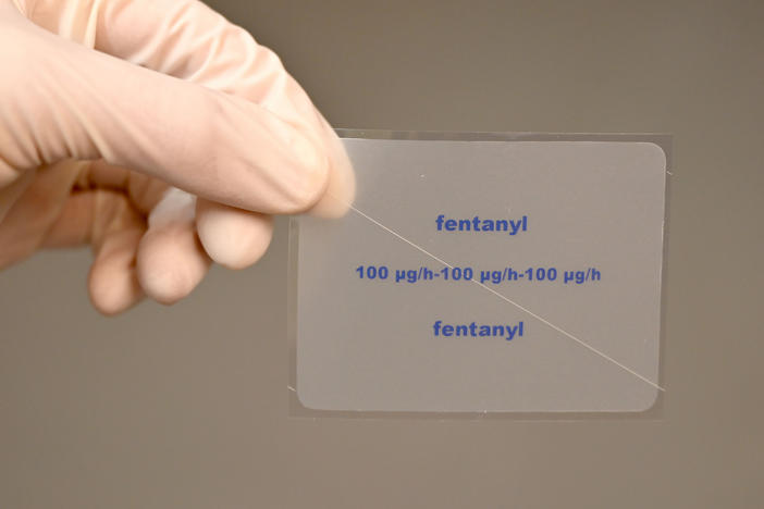 A patch containing the active ingredient fentanyl is shown by a pharmacist. The painkiller fentanyl, which can be up to 100 times stronger than heroin, is a growing cause of overdose deaths in the U.S., according to the DEA.