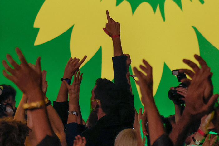 Supporters of Germany's Green Party celebrate after estimates were broadcast on television in Berlin at their electoral party on Sunday after the German general elections.