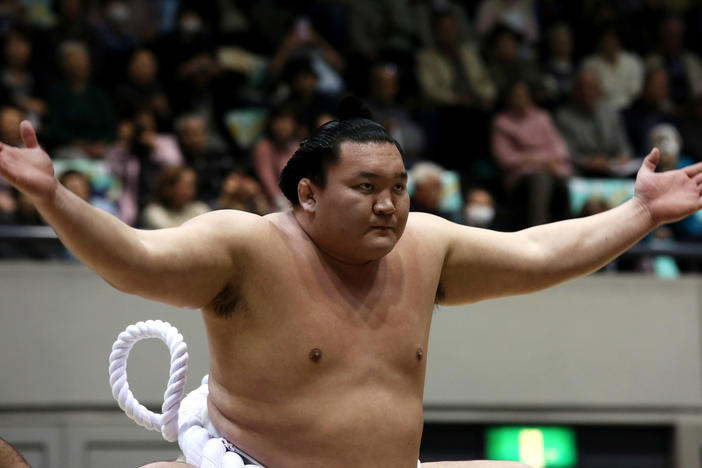 Sumo Grand Champion Hakuho performs Dohyo-iri, the ring-entering ceremony, during the Grand Sumo Tournament at the Himeji Chuo Gymnasium, in March 2015, in Himeji, Japan.
