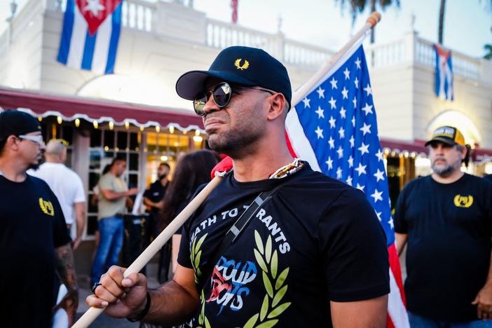 Henry "Enrique" Tarrio, leader of the Proud Boys, holds a U.S. flag during a July protest in Miami as part of a show of solidarity for Cubans who were demonstrating against their government in Cuba.