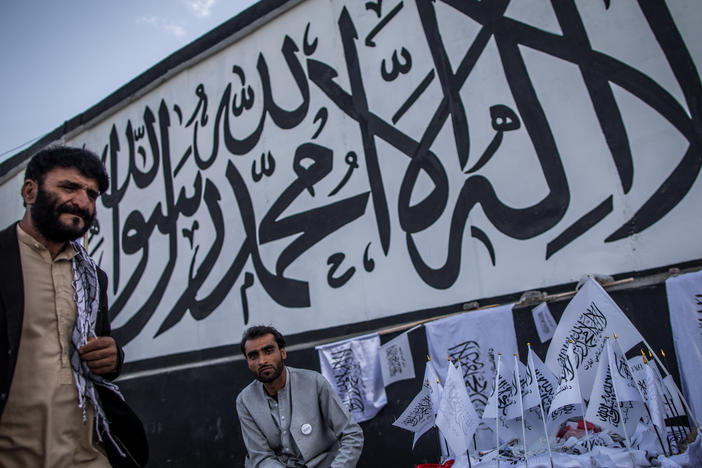 A man sells Taliban flags imprinted with the Muslim creed in Kabul, Afghanistan, on Sept. 24.