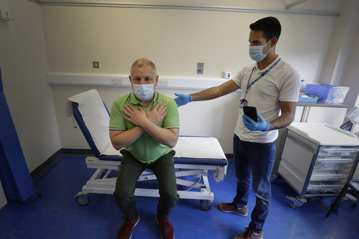 Long COVID patient Gary Miller receives treatment from physiotherapist Joan Del Arco at the Long COVID Clinic at King George Hospital in Ilford, London, in May.