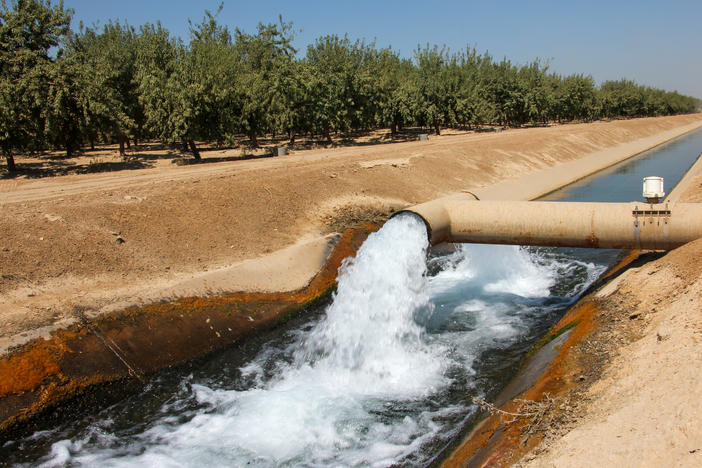 California's farmers are pumping billions of tons of extra water from underground aquifers this year because of the drought. But new restrictions on such pumping are coming into force.