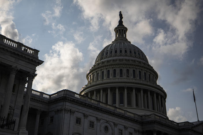 Congress is moving to avert one crisis while putting off another. Both the House and Senate approved legislation Thursday that would fund the federal government through Dec. 3.