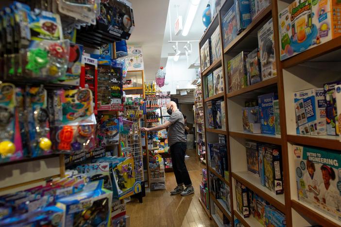 An employee organizes an aisle at Mary Arnold Toys, New York City's oldest toy store, on Aug. 2.