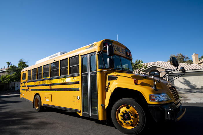 A Clark County, Nev., School District school bus drives through a Summerlin neighborhood last month. The National School Boards Association included an incident from Clark County in its letter to President Biden.