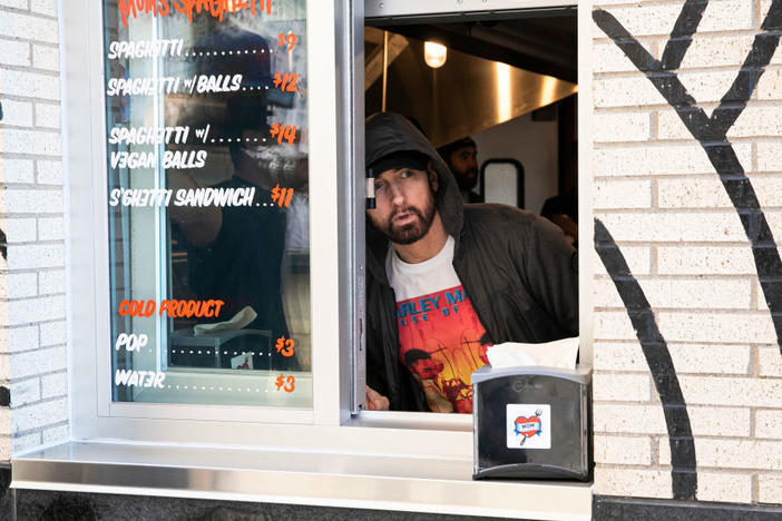 Eminem serves customers on the opening night of his restaurant Mom's Spaghetti in Detroit on Wednesday.