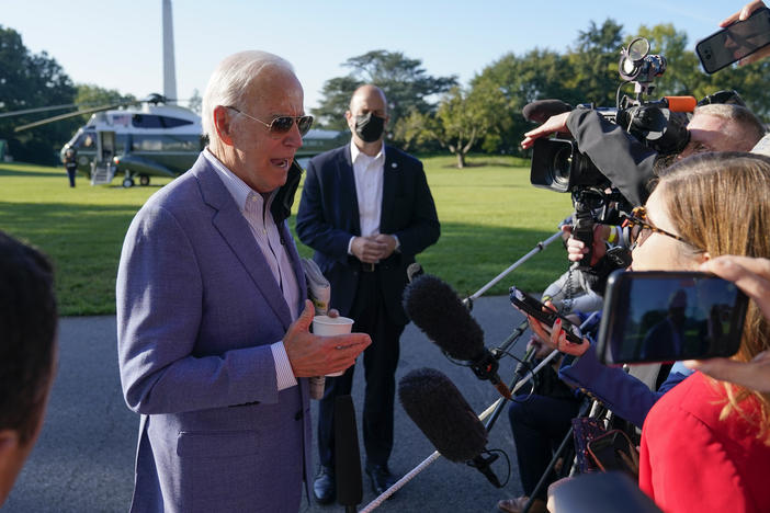 President Joe Biden speaks with members of the press before boarding Marine One on the South Lawn of the White House, Saturday, Oct. 2, 2021, in Washington. Biden spent the weekend at his home in Delaware.