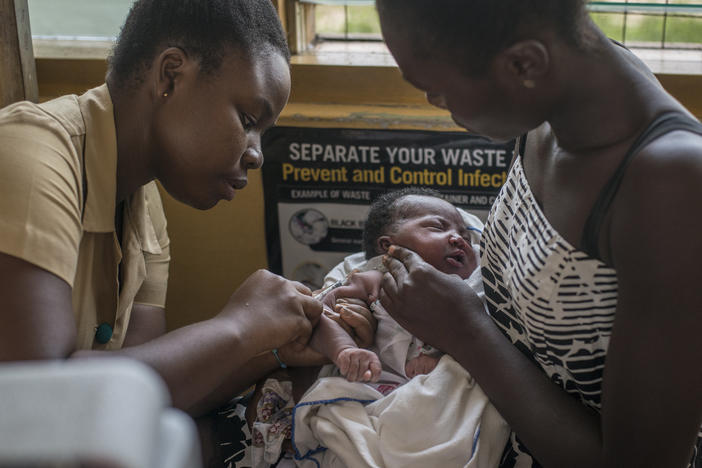 A nurse administers the world's first malaria vaccine during a 2019 pilot program in Ghana. The World Health Organization has now recommended the vaccine for use in countries with moderate to high levels of malaria transmission.