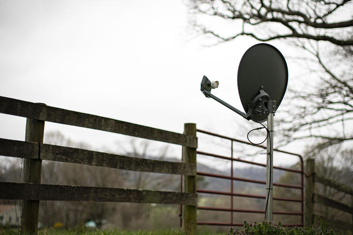 A Viasat internet satellite dish is seen in the yard of a house in Madison, Va., on March 31.