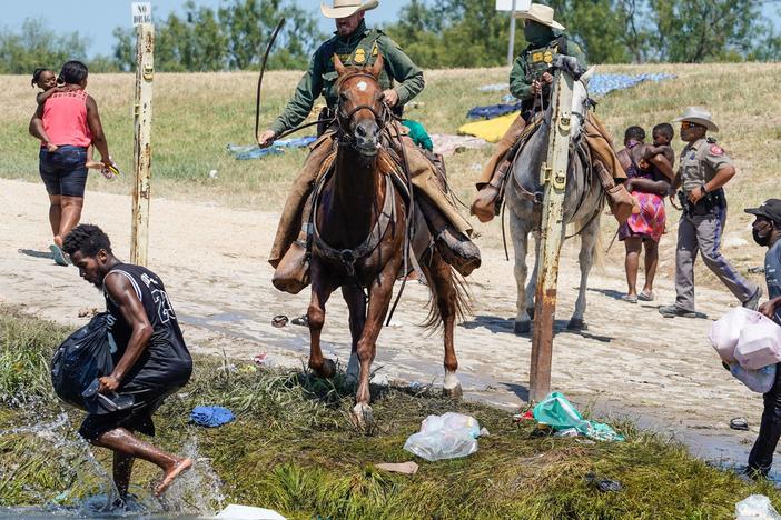 United States Border Patrol agents on horseback try to stop Haitian migrants from entering an encampment on the banks of the Río Grande near the Acuña Del Río International Bridge in Del Río, Texas on Sept. 19.